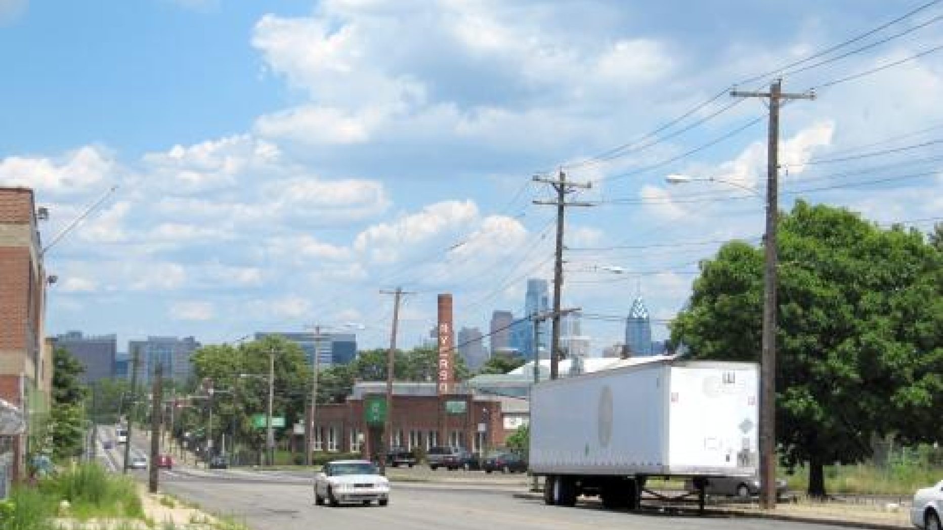A street view in West Philadelphia with Center City in the background.