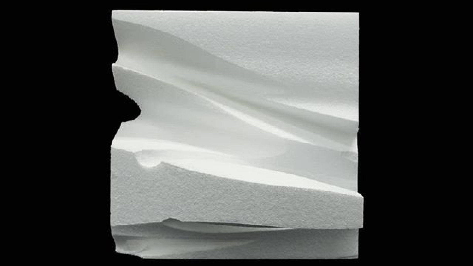 Abstract white block sculpture.
