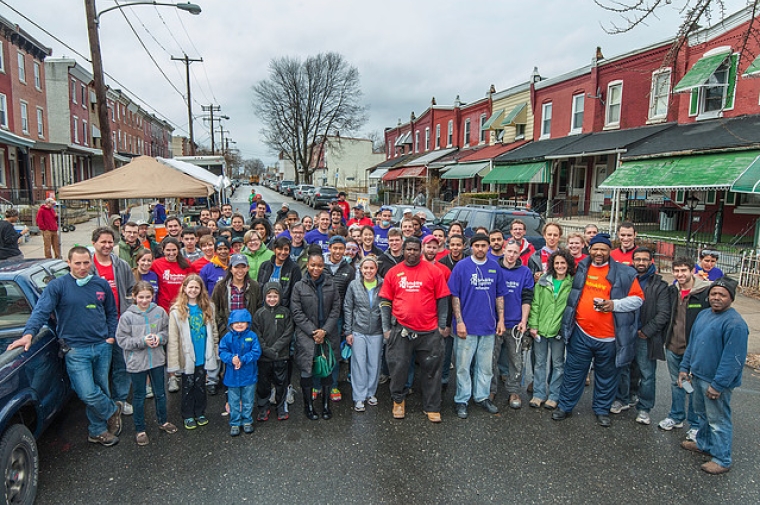Photo of the Mantua group from rebuildingphilly.org standing in street in Mantua neighborhood.