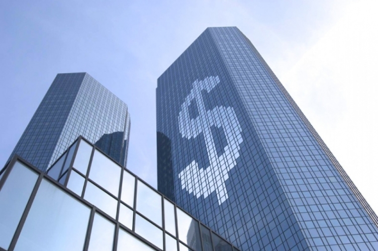 Skyscraper with large dollar sign reflected in windows