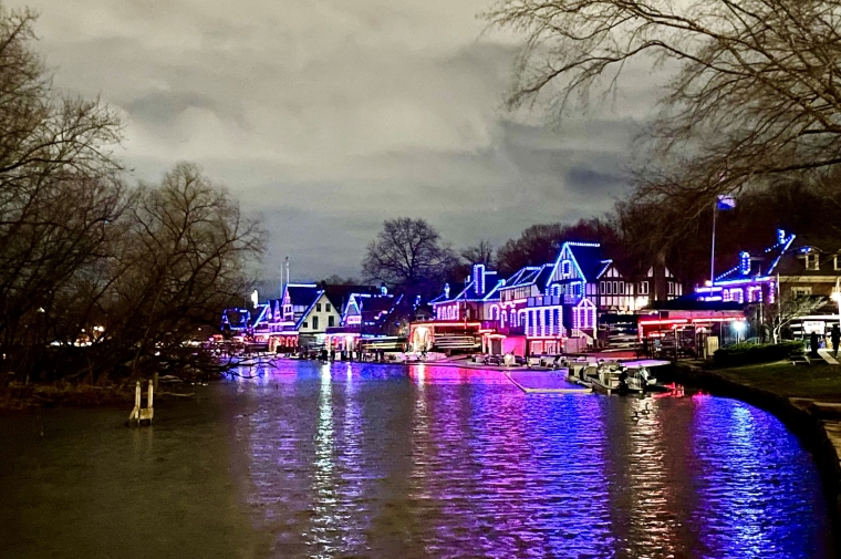 Boathouse row lit up at night