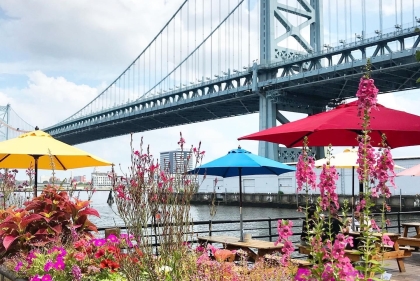 Dining on the water surrounded by beautiful spring flowers and a view of the Benjamin Franklin Bridge.