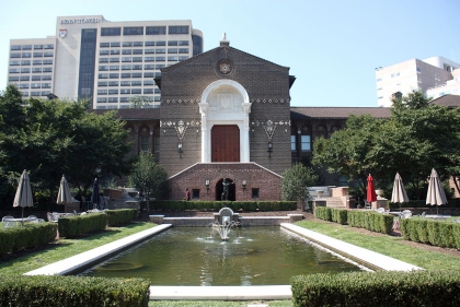 Front view of the University of Pennsylvania Museum, showing the grand arched entrance as well as the coy fish pond.