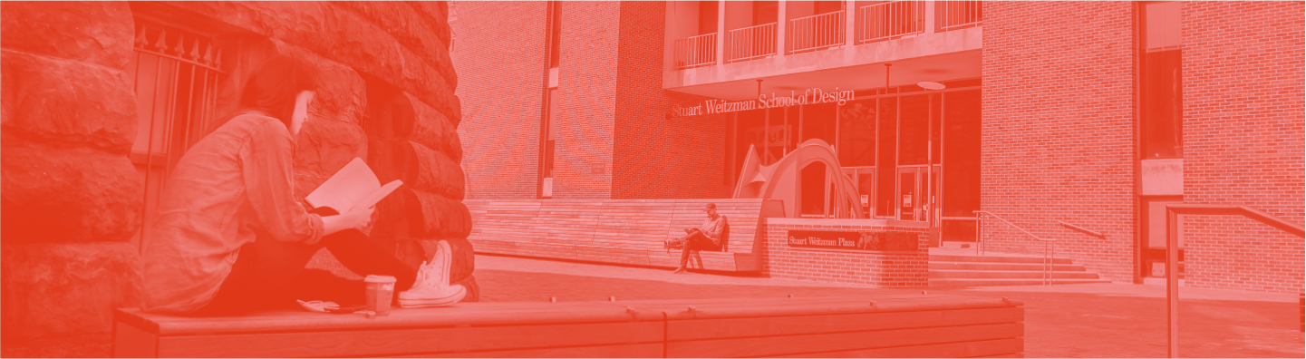 student sitting on wall