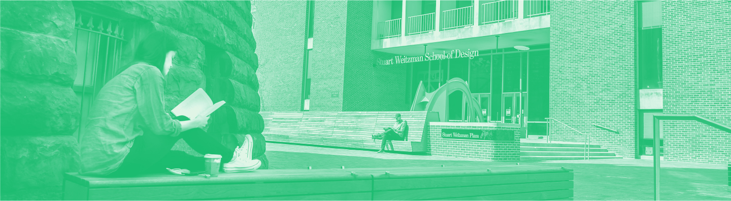 student sitting on wall