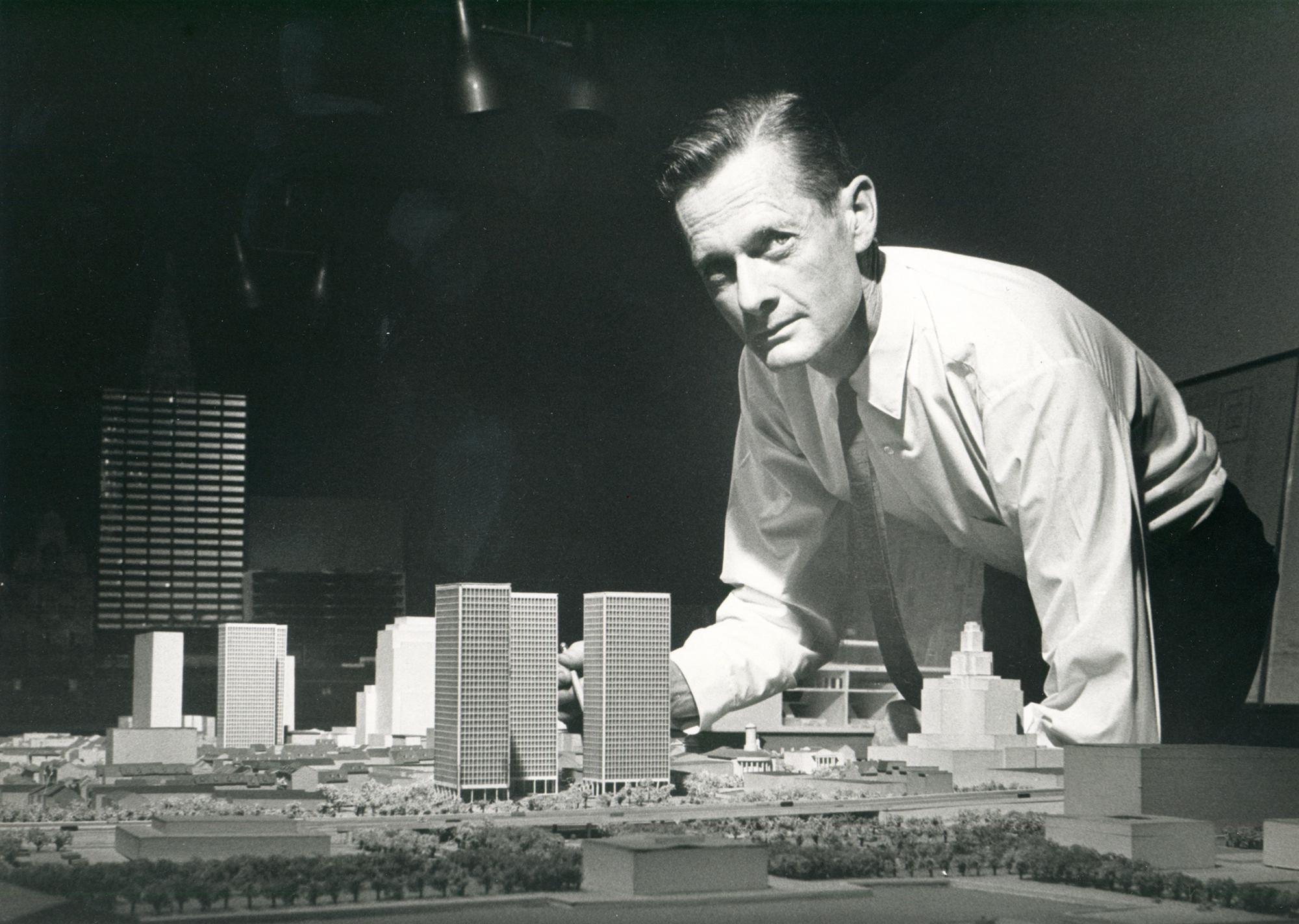 Edmund Bacon posing with architectural model