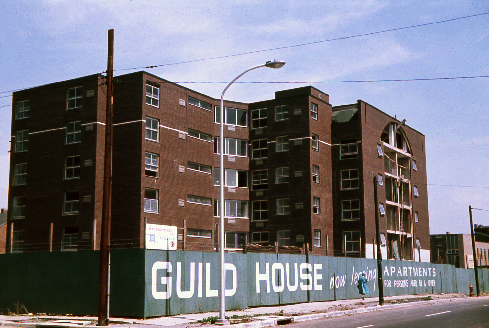 Color photo of an apartment complex under construction
