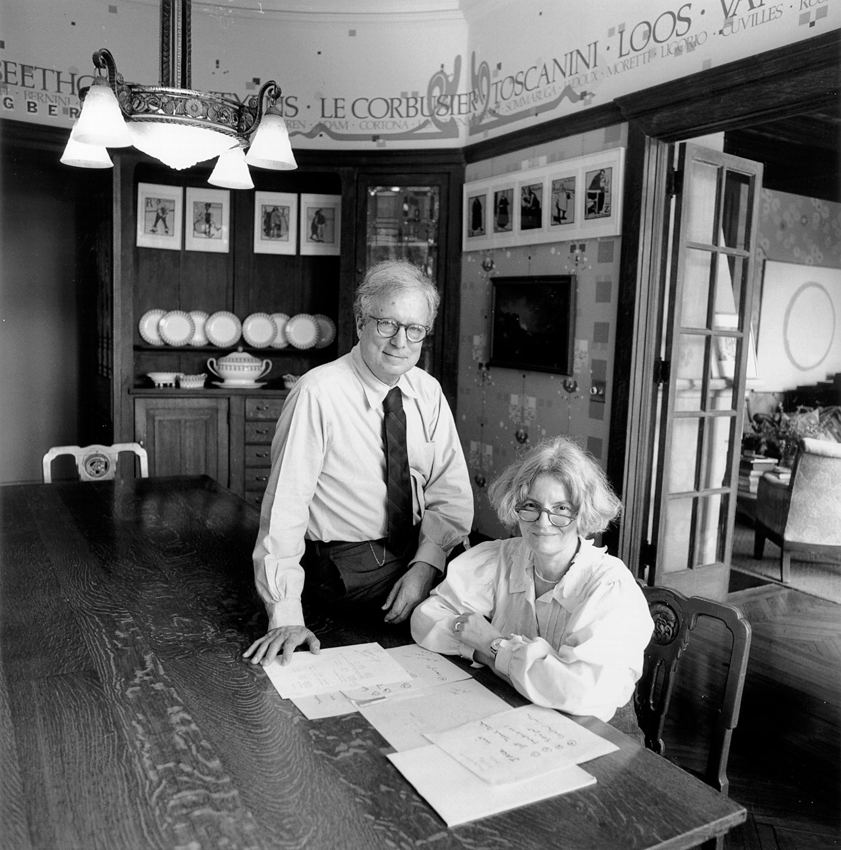 Blakc and white photo of man and woman at dining room table