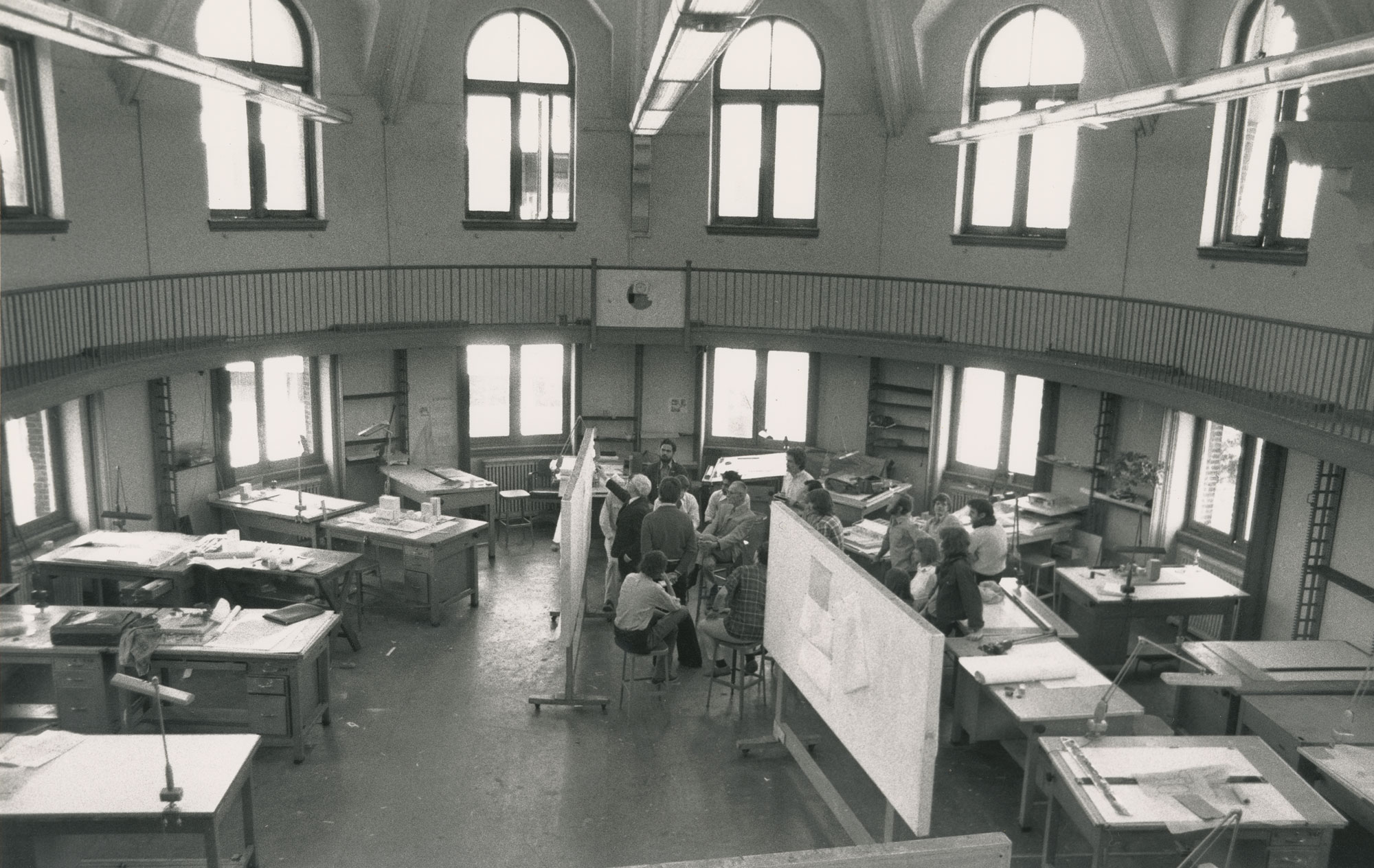 Blck and white photo of Louis Kahn with student in Fisher Fine Arts Library third floor studio