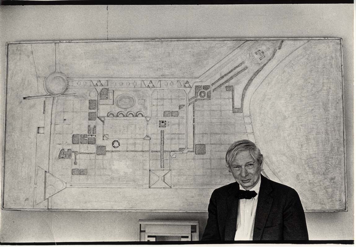 Louis Kahn in front of mold for his Philadelphia Mark East plan