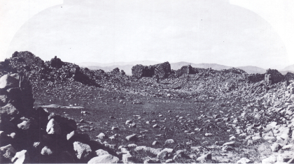Black and white photograph of a rubble stone structure