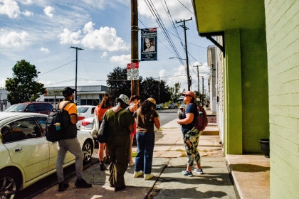 students on sidewalk in small town