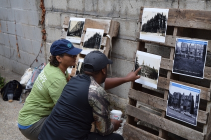 Two people looking at photographs.