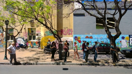 Street view of people waiting for bus