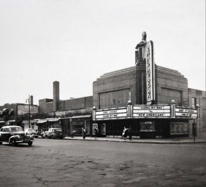 Black and white photo of a street corner in midcentury Detroit