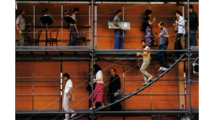 Renzo Piano’s “Ark” for Prometeo: A Tragedy of Listening. Photograph of musicians practicing walking around the audience below.	Moving sound source creates a sense of space. Image from Pellisier, Alain.  “Entretien Avec Renzo Piano.”  Techniques et Architecture.  (1985) Page 104