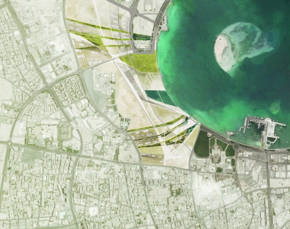 Overhead view of large city area with waterfront.