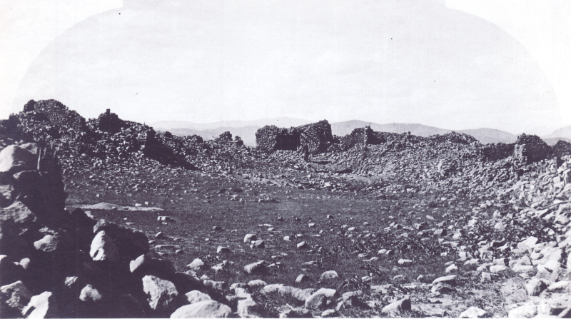 Black and white photograph of a rubble stone structure