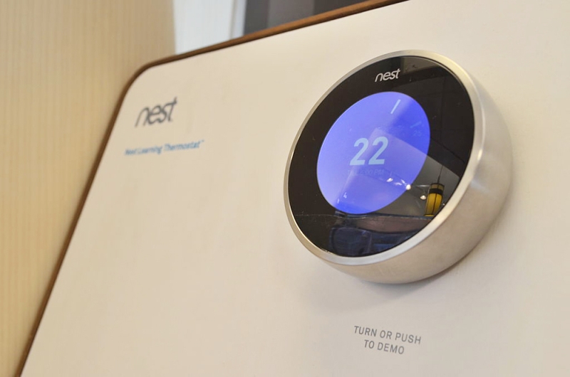 Nest thermostat with round display showing 22 degrees