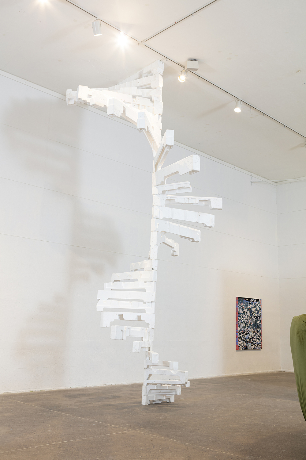 Sculpture resembling white spiral staircase except that steps are too thin to be actual steps