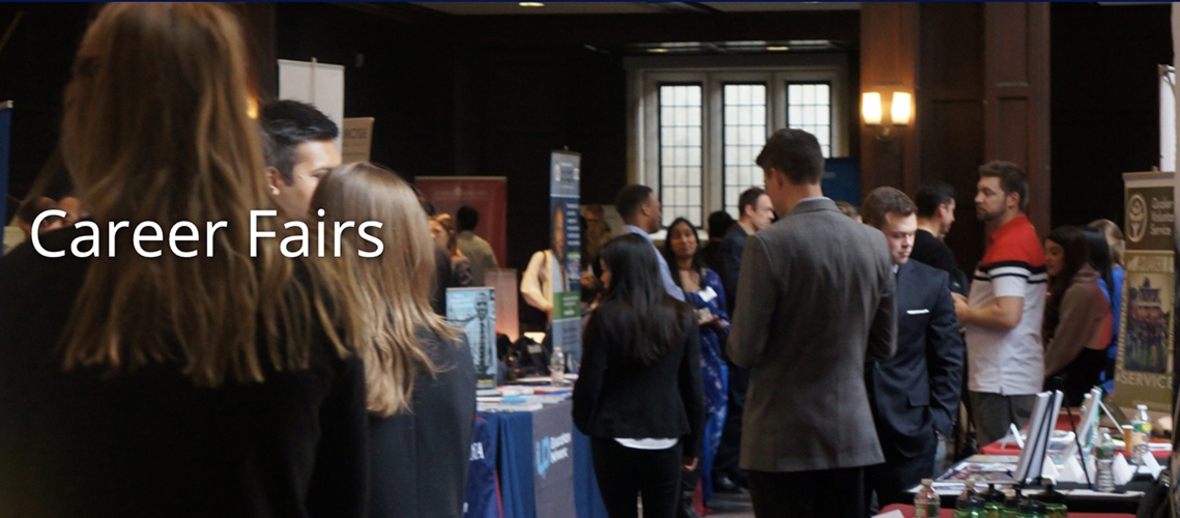 Students and employers talking at a past career fair held in Houston Hall.