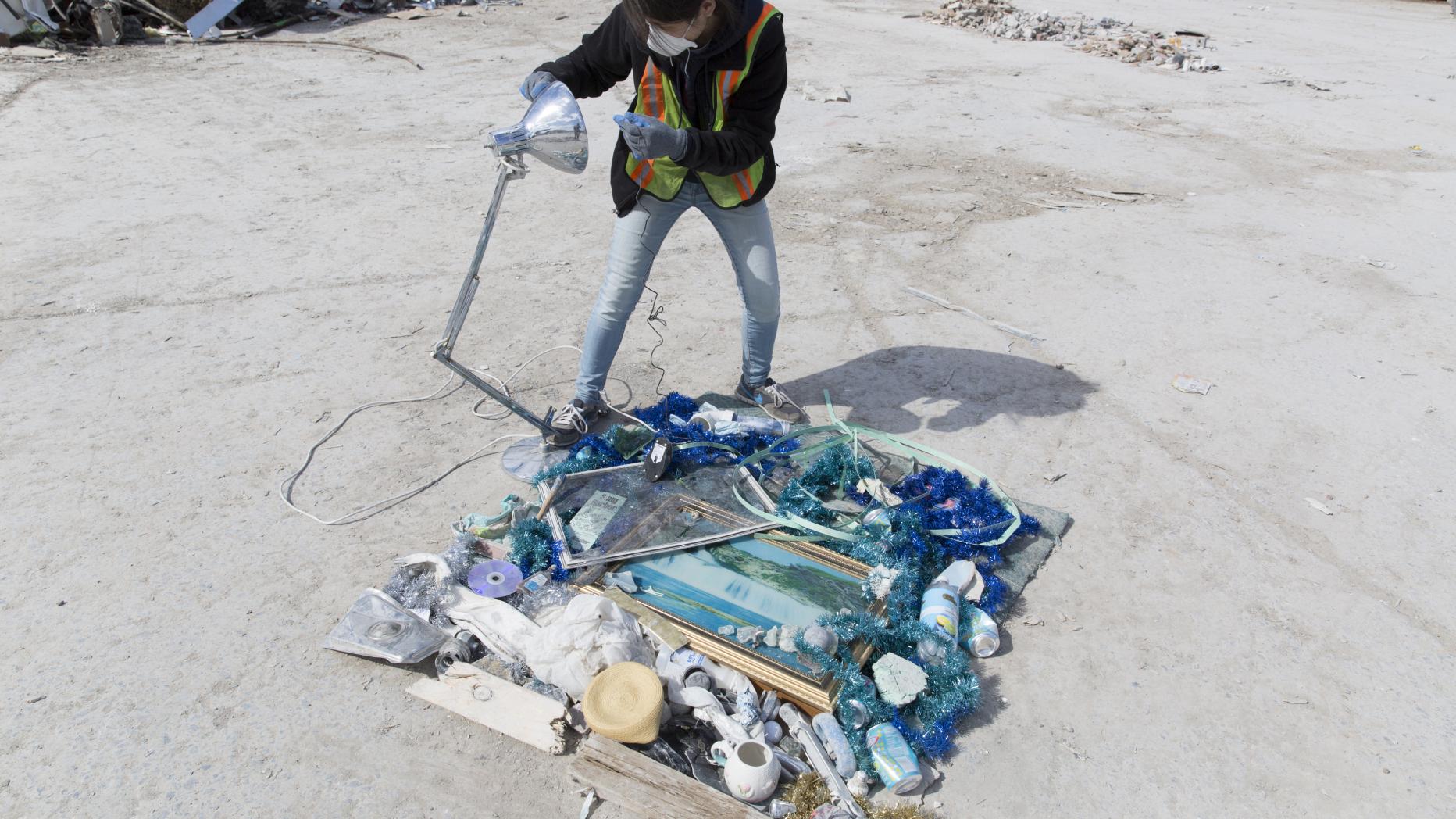 Woman creating art from trash