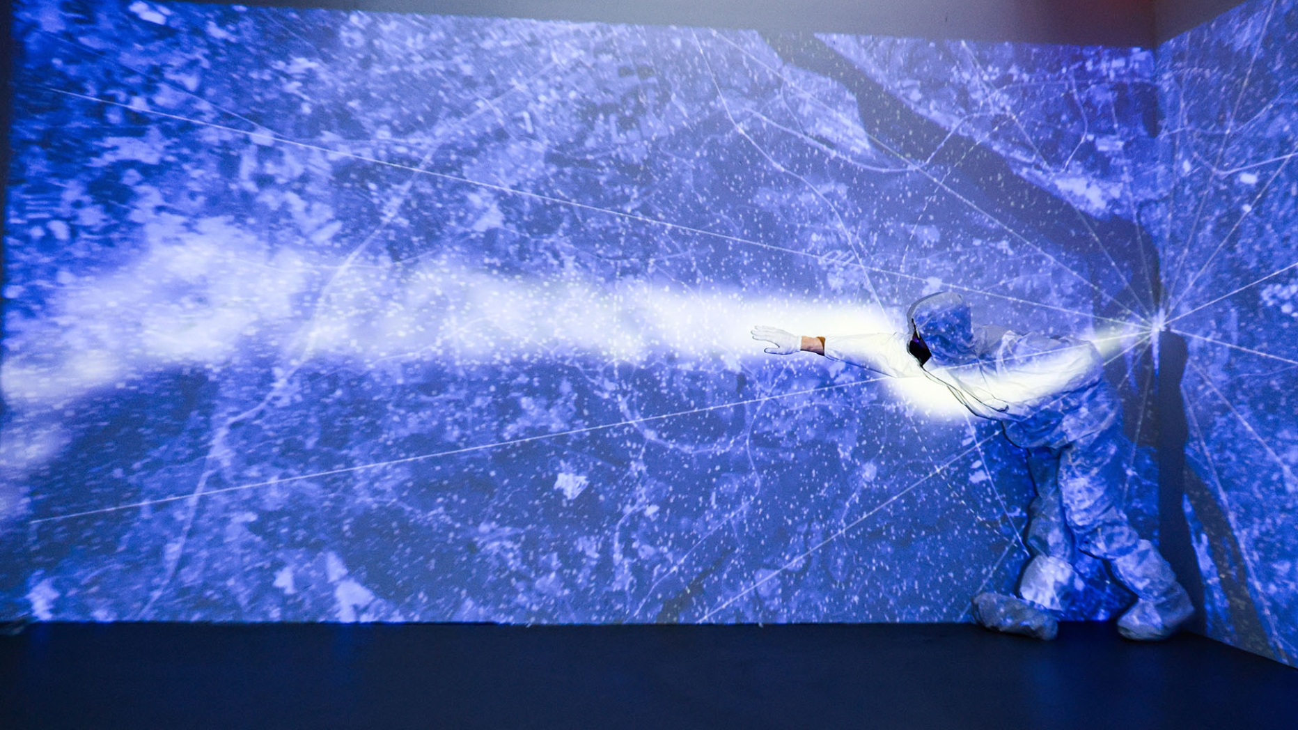 Performer in front of a projection