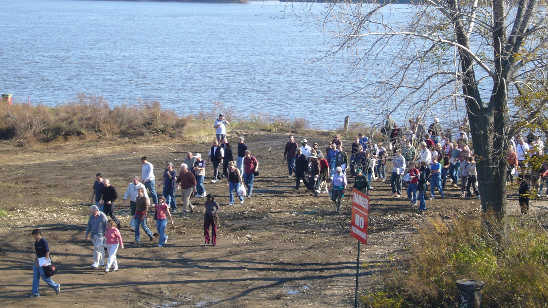 Crowd participating in the Central Delaware riverfront planning process walks along the Delaware river.