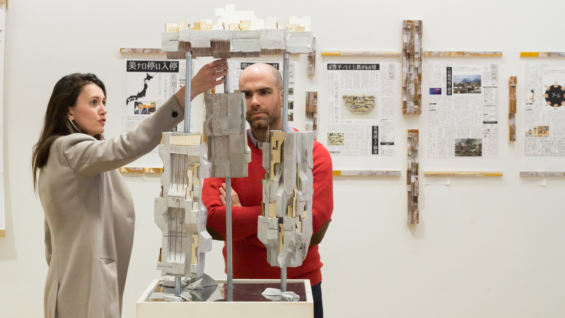 Exhibit in gallery with two people looking.