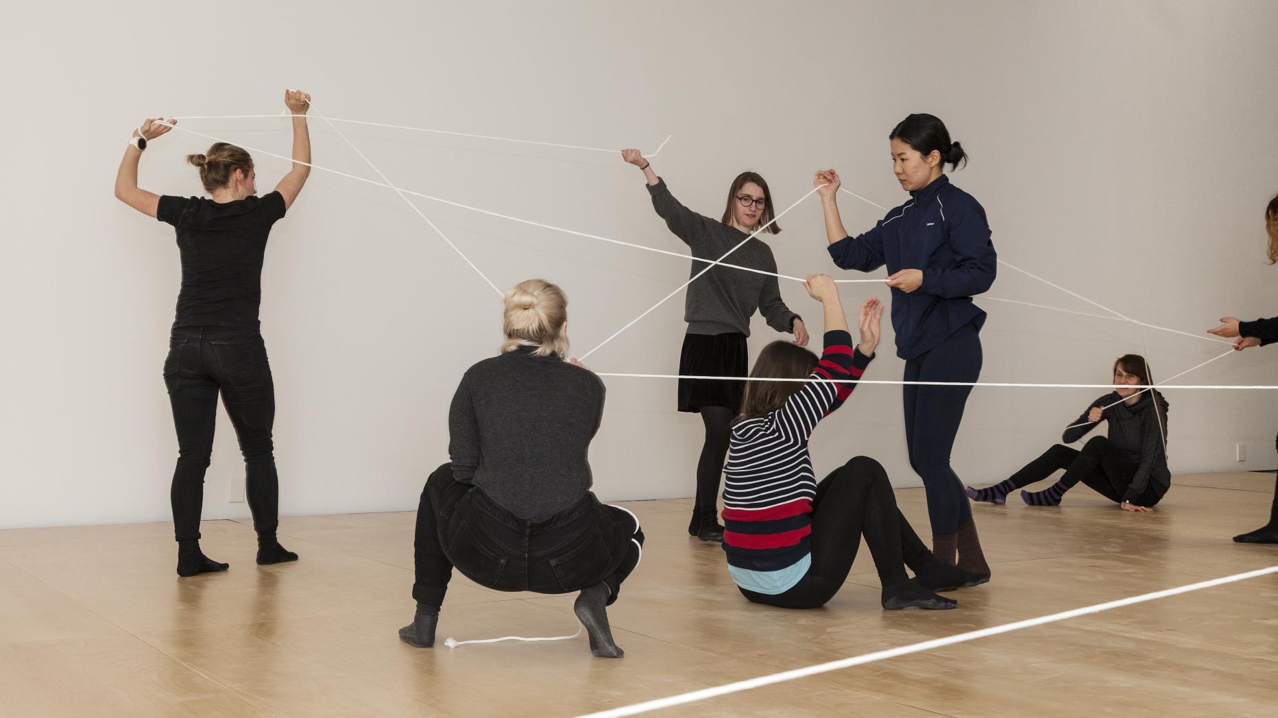 Performers using string as a performance media