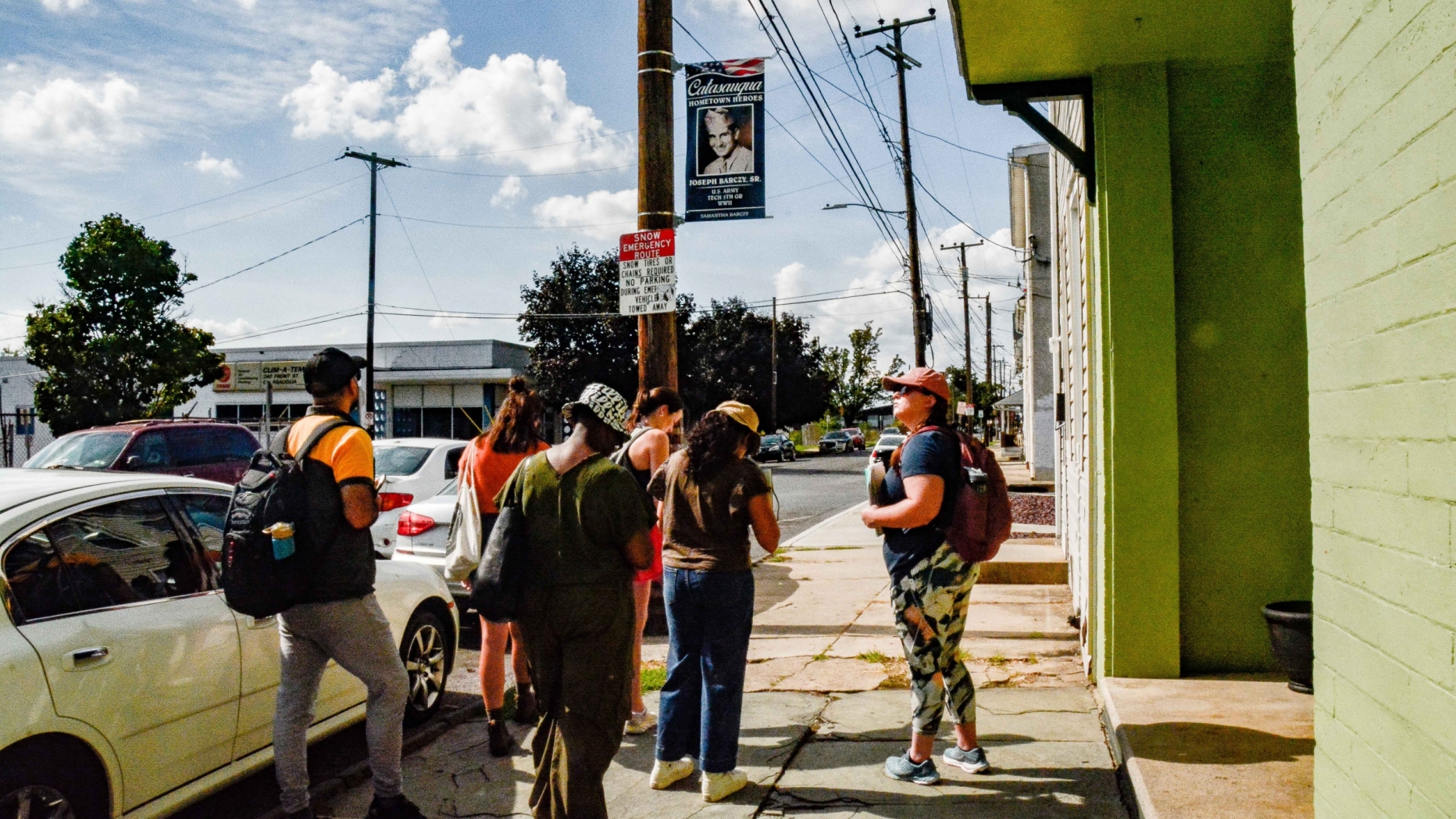 students on sidewalk in small town