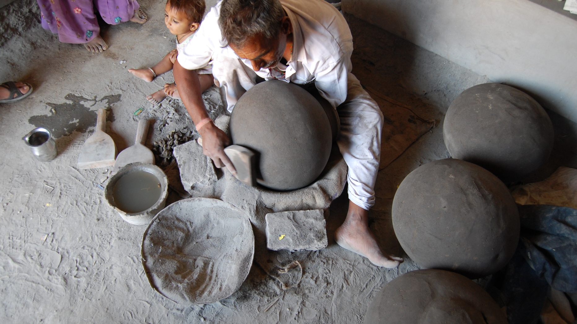Potter making pottery.