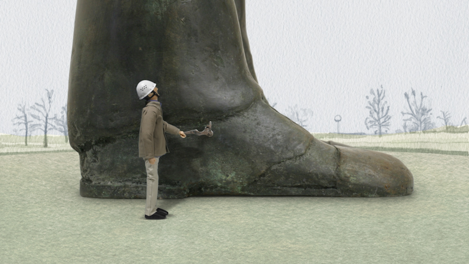Man standing next to giant leg and shoe