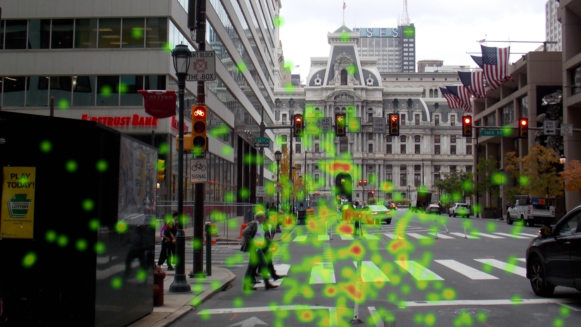 Display of eye tracking data superimposed over photograph of street view.