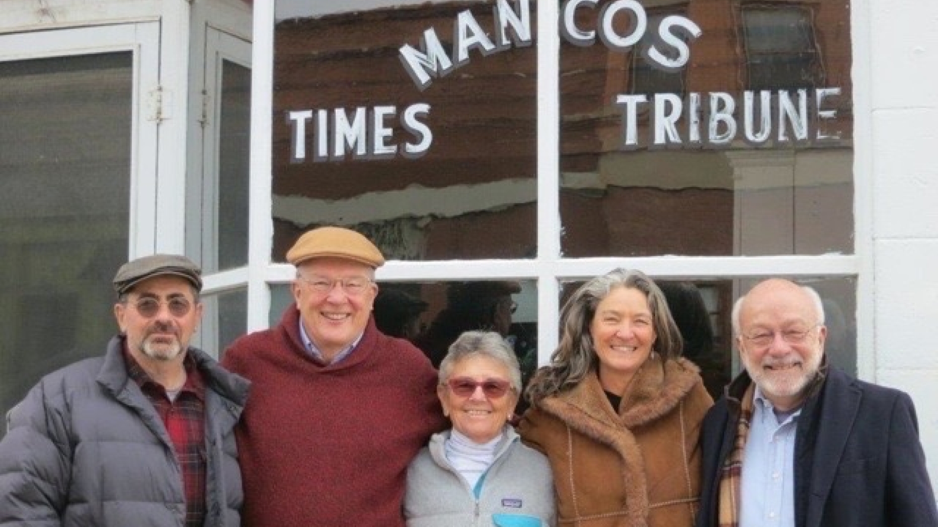 Group shout outside Mancos building.