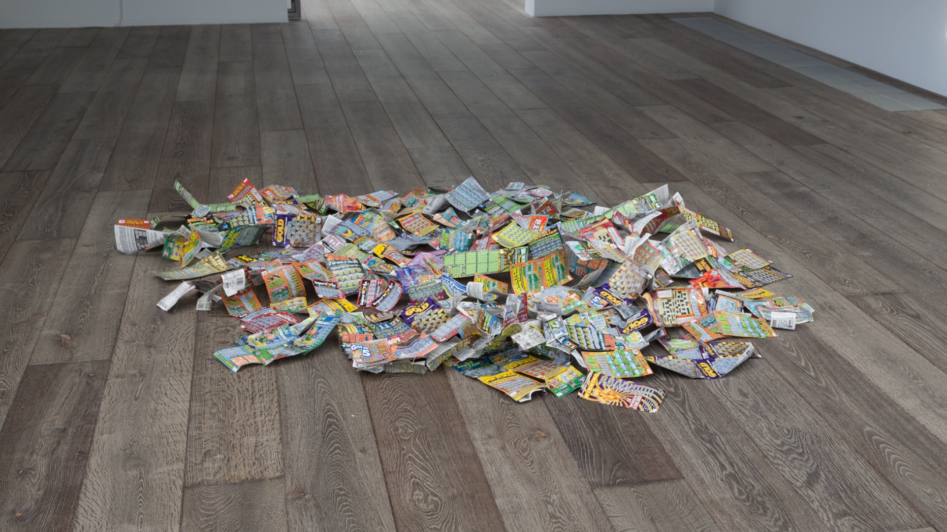 Pile of lottery tickets on the floor.