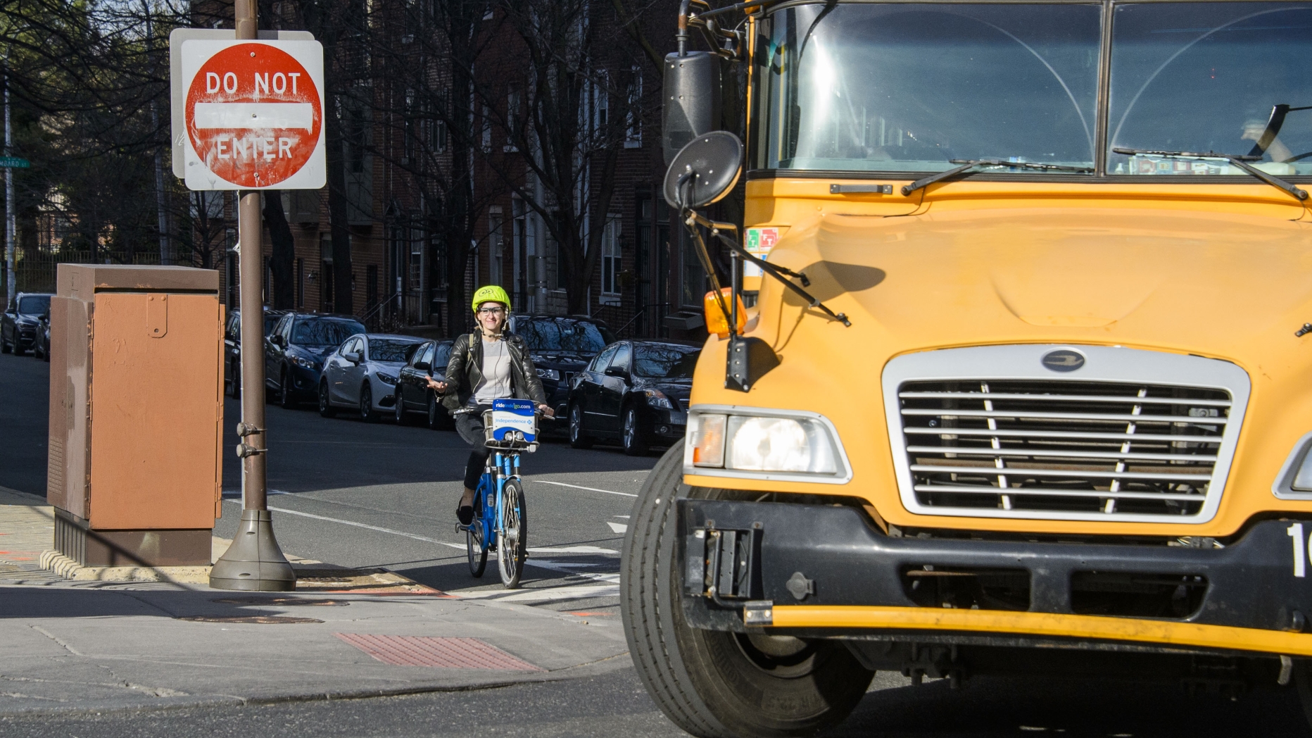 Cyclist near turning schoolbus