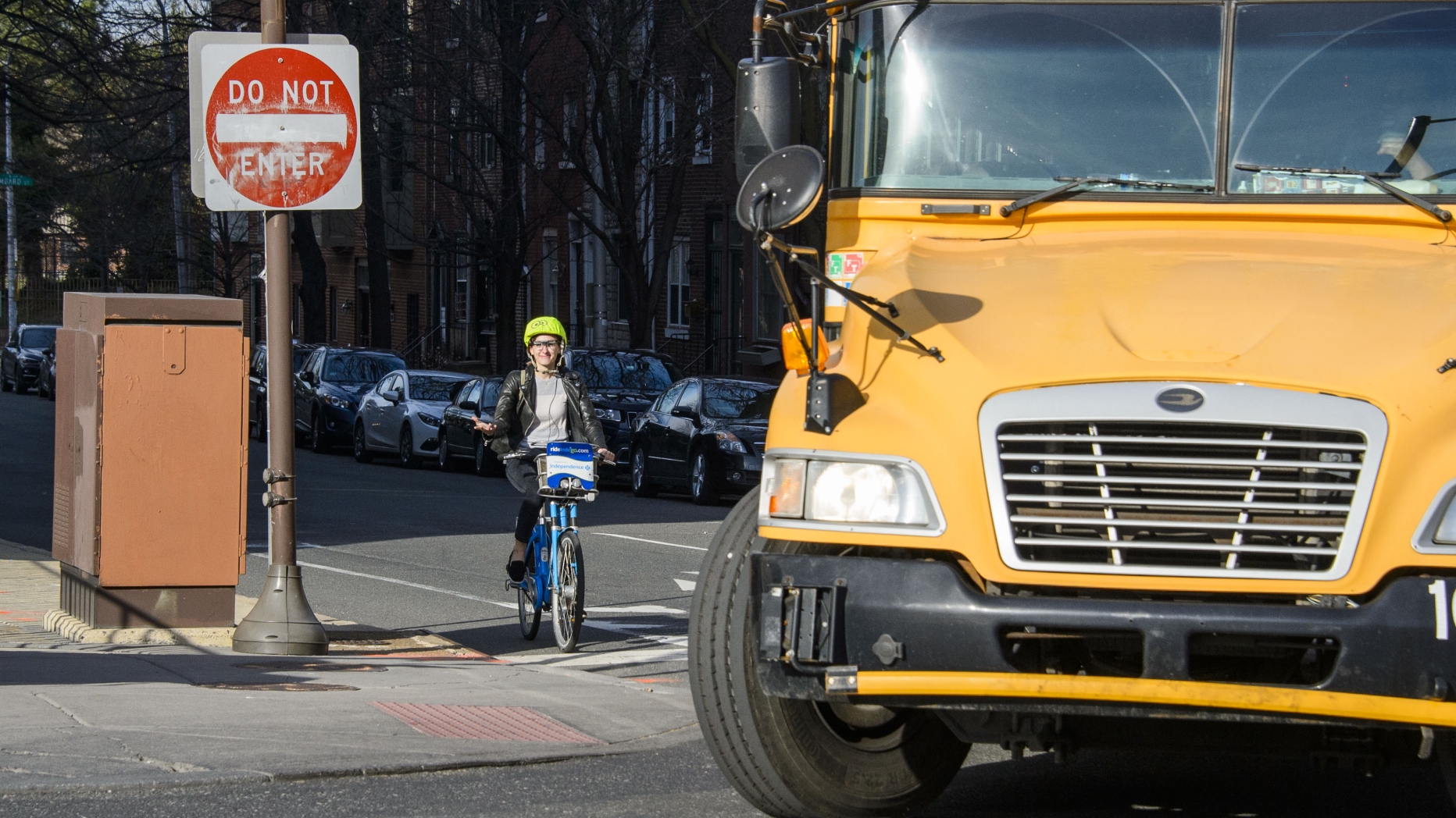 Cyclist near turning schoolbus