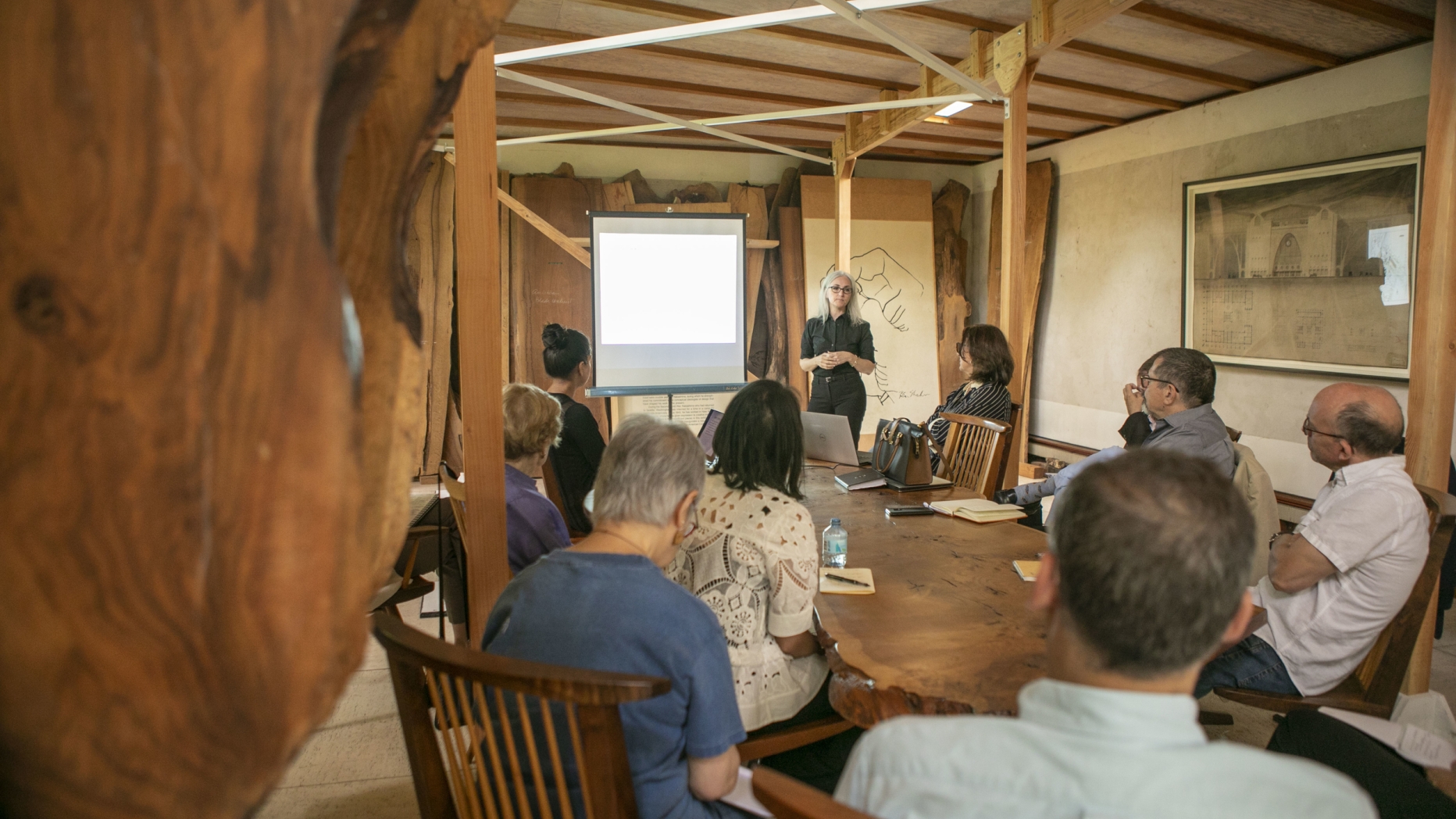 Holly Manders Boyer presenting research to the leaders of the Nakashima Studio.