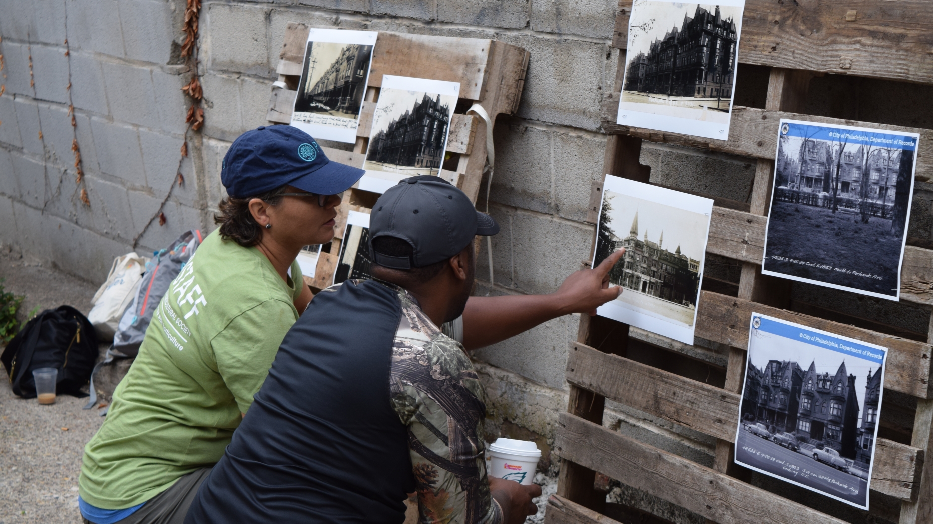 Two people looking at photographs.