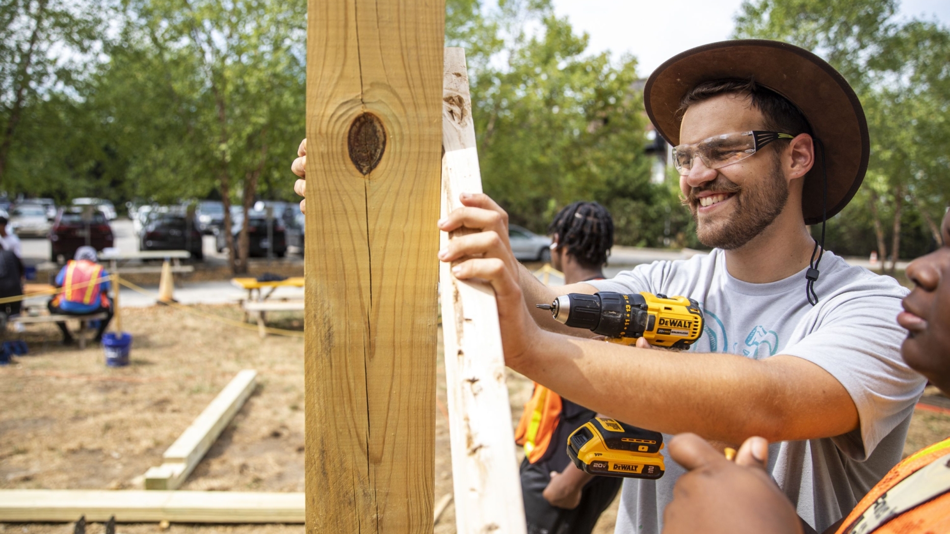 A person working on a wooden structure