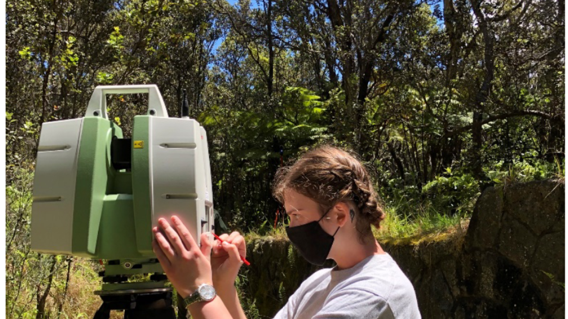 Tali Flatte operating a total station at Hawai'i Volcanoes National Park.