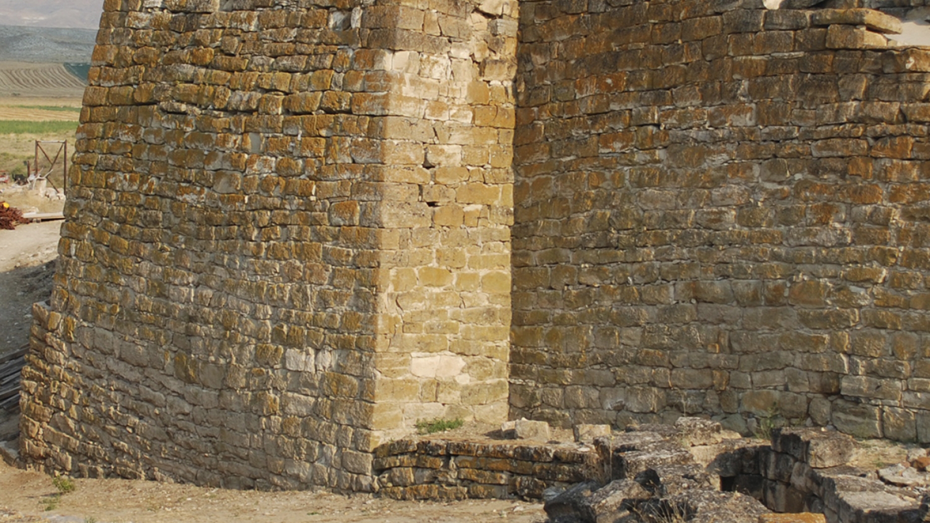 Stone wall from an ancient structure at the archaeological site.