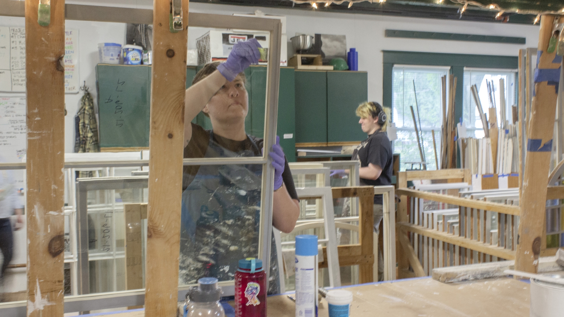 Image of myself doing detailing work on a sash. This step is the final clean up after glass installation and before first coat p