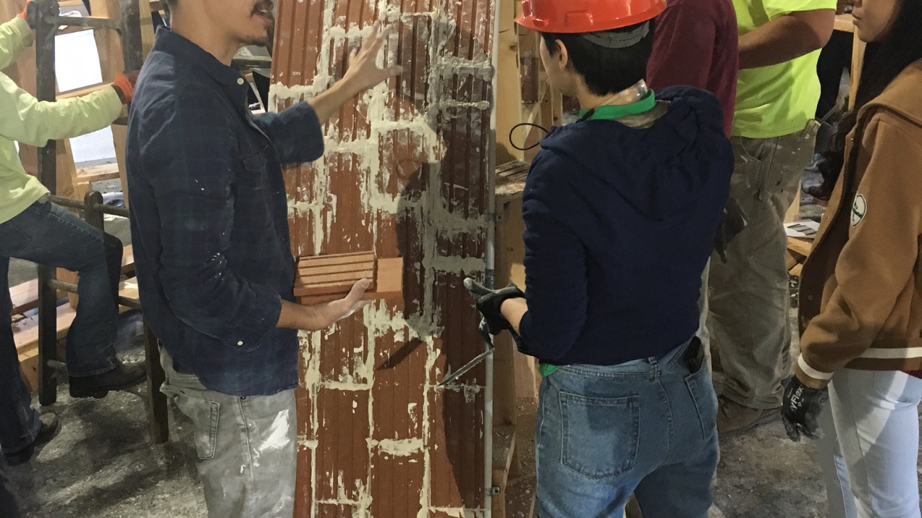 People working of brick structure.