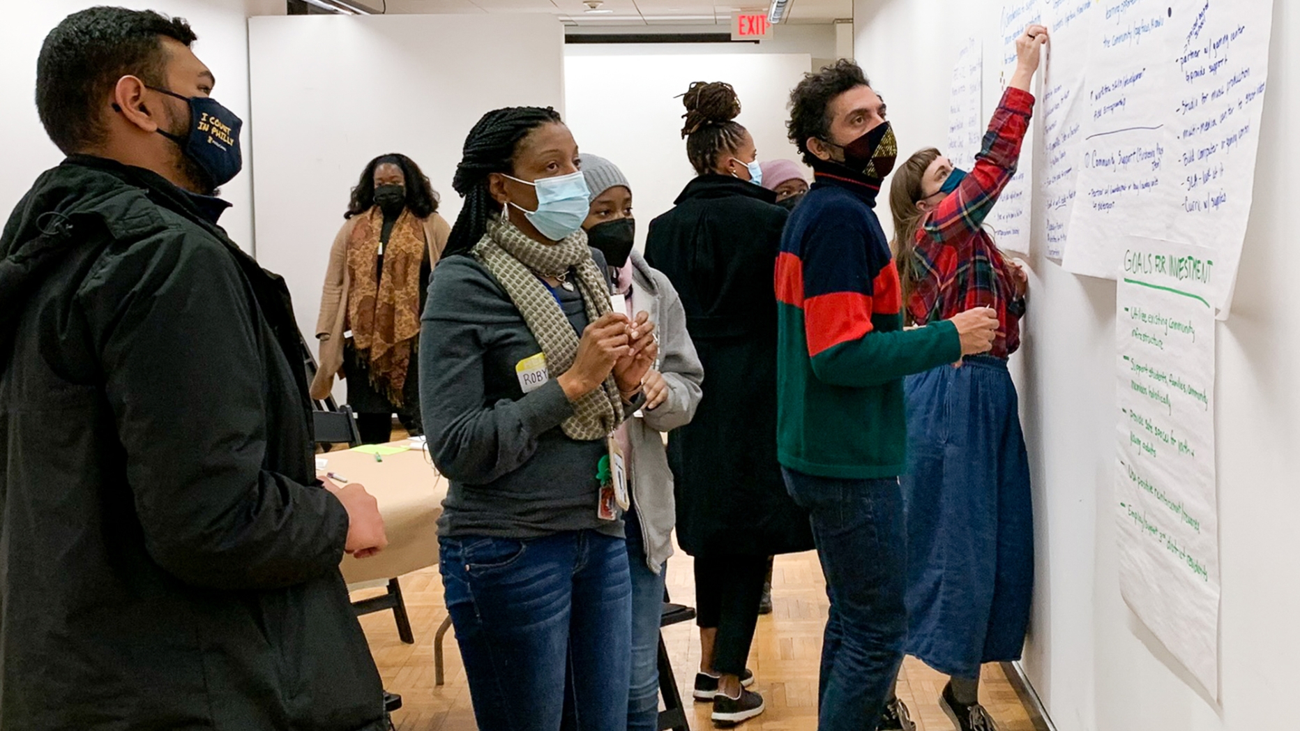 A group of masked people at a pin-up