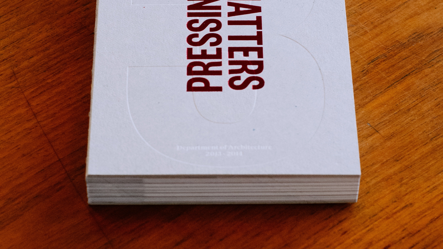 Copy of publication 'Pressing Matters 3"on wooden table.