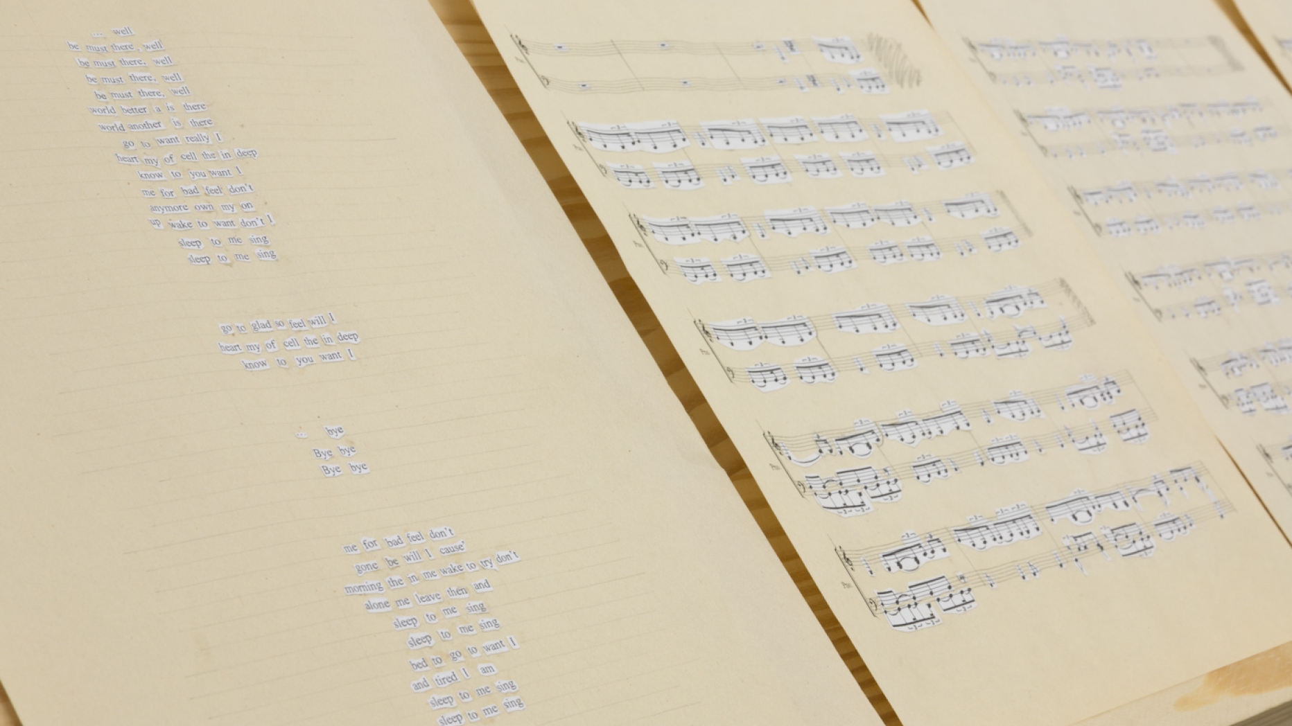 Pages showing blue handwriting and also blue handwritten musical notation.