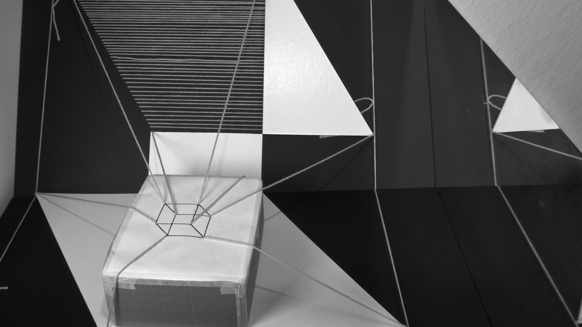 Photograph of sculpture featuring different lines and shades of black white and grey that confuse the eye of the viewer.