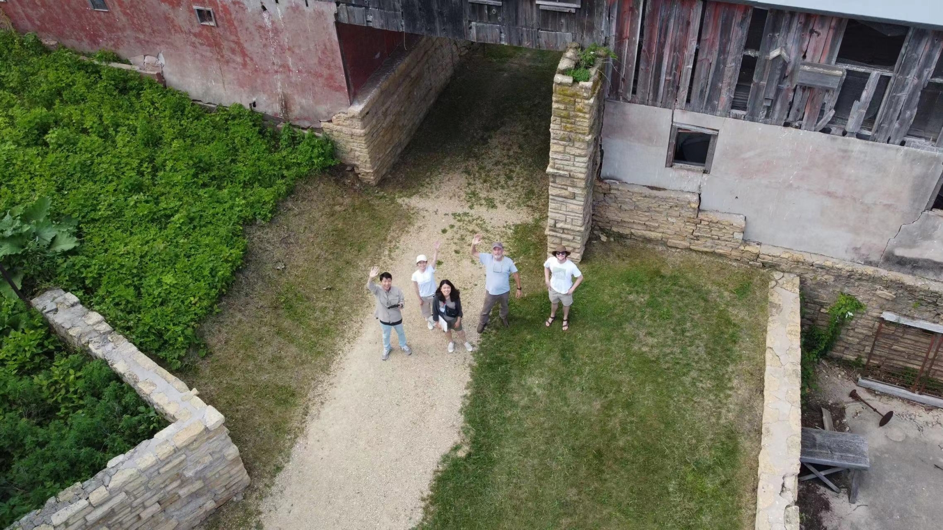 The group photo of the CAC team underneath the Midway Barn.